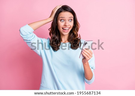 Photo of young attractive girl shocked surprised news comment blogger look cellphone isolated over pink color background Royalty-Free Stock Photo #1955687134
