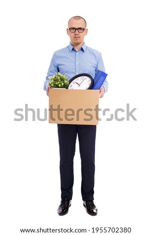 business man with his belongings in cardboard box isolated on white background