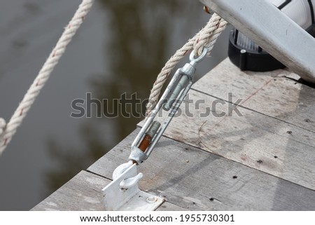 steel turnbuckle and rope for wooden bridge.