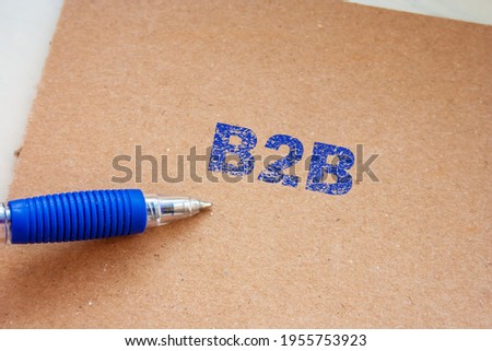 The B2B inscription on note. Word B2B on paper message.