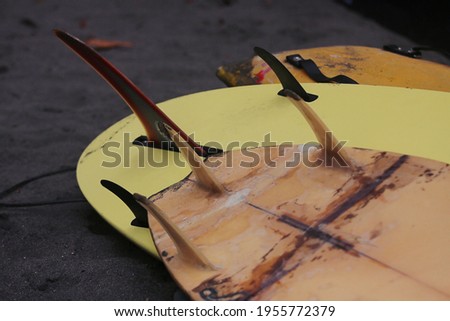 Close up surfboard placed on the beach