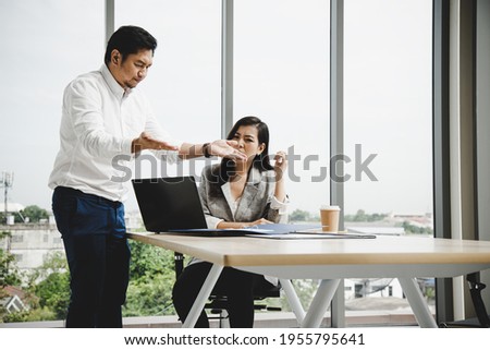 Manager Claiming to secretary report laptop in meeting room; Business stress concept