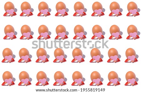 A creative pattern of an egg figure holding a pink heart in her hands. 
