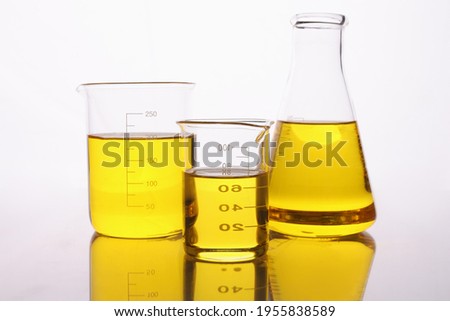 Chemical test tubes and flasks with yellow oil