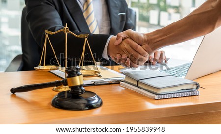 Consulting of businessmen and male lawyers or judge advisors with team meetings with clients in the legal concept office.