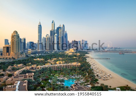 Dubai Marina with skyline - luxury and famous Jumeirah beach frontline at sunrise, United Arab Emirates Royalty-Free Stock Photo #1955840515