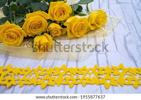 Flower decoration with yellow roses an ornament web on a light background. Template for Valentine's Day, Mother's Day, Wedding, Birthday.