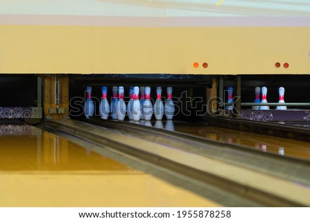 Lead machine bowling pinsetter and lane sport community center activity recreation indoor game lifestyle. Target score in competition. Entertainment