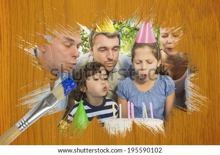 Composite image of family celebrating a birthday with paintbrush dipped in blue against wooden pine table