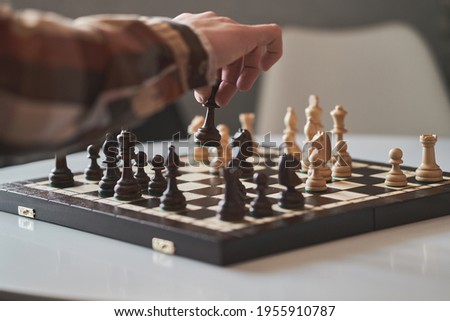 Chess, pawn, Chess pieces are located on a wooden board. Expressive texture of wood pawn, carp