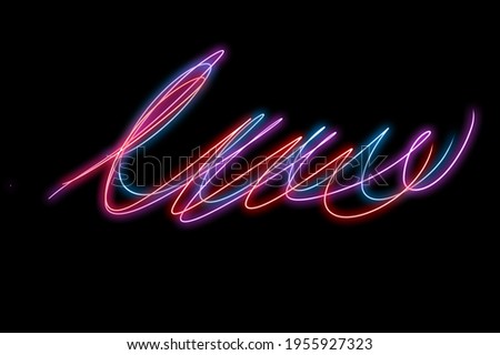 Long exposure effect, light painting effect, Neon lines of color, curving and wavy lines isolated in black background