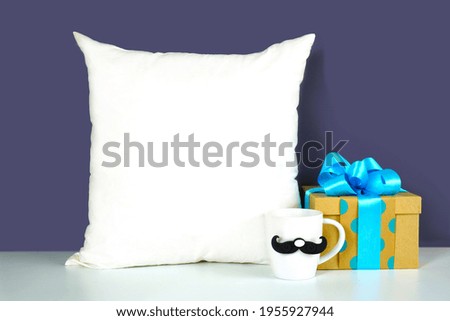 Father's Day or masculine birthday theme throw pillow styled with gifts. White product mock up with negative copy space for your text or design here.