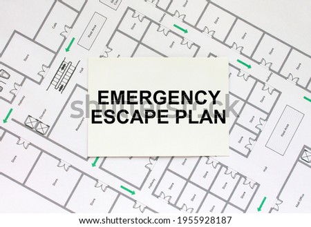 Business card with text Emergency Escape Plan on a construction drawing. Concept photo