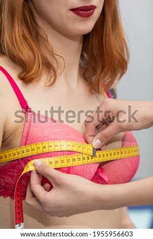 A doctor measures the chest circumference of a young patient. Close-up view Royalty-Free Stock Photo #1955956603