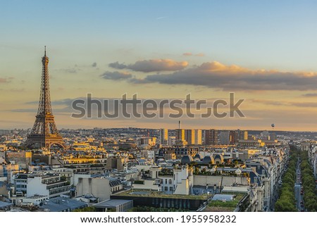 Paris view from the top of Arc de Triomphe de l'Etoile on sunset. Eiffel Tower on the background. France.