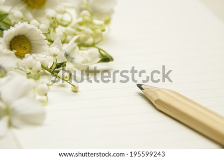 Invitation card. Note paper with pencil and flowers.