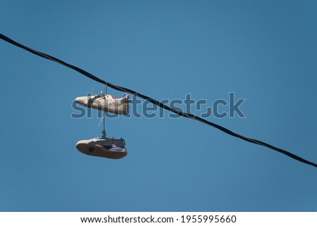 shoes hanging by laces on a phone power line near the skate board park in yakima washington along fair aveneue