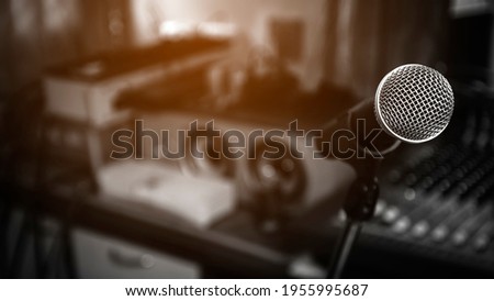 technology and audio equipment concept.close up of microphone wireless On a stand at a recording studio.