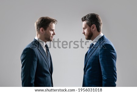 businessmen face to face. disrespect and contradiction. business partners blame each other. arguing businesspeople. dissatisfied men discuss failure. two colleagues have disagreement and conflict. Royalty-Free Stock Photo #1956031018