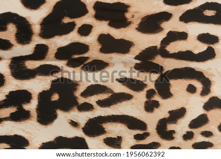 Leopard seamless pattern. Leopard spots. fabric texture closeup


