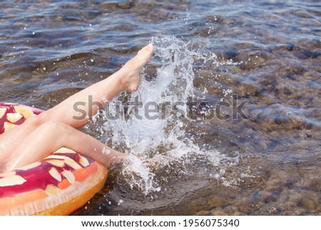 Young beautiful girl resting on the ocean