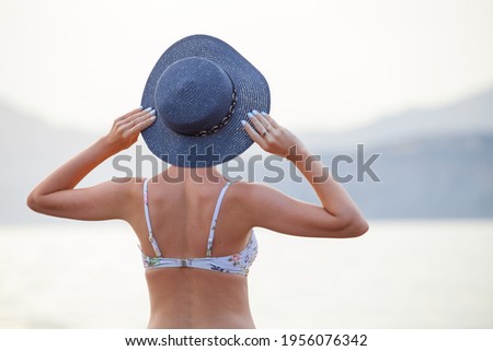 Young beautiful girl resting on the ocean