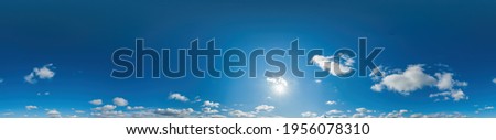 Blue sky panorama with Cirrus clouds in Seamless spherical equirectangular format. Full zenith for use in 3D graphics, game and editing aerial drone 360 degree panoramas for sky replacement. Royalty-Free Stock Photo #1956078310