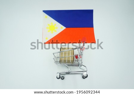 Shopping trolley and flag of philippines on white background. Online shopping concept