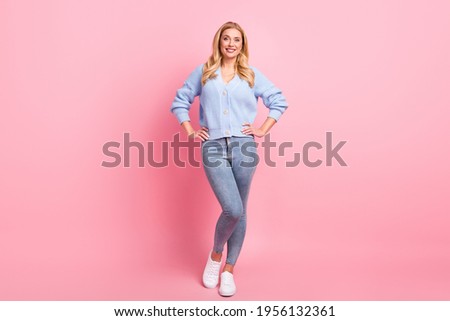 Full size photo of young pretty charming smiling positive woman posing on camera isolated on pink color background