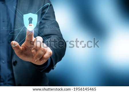 Cyber security concept with businessman touching virtual interface with keyhole