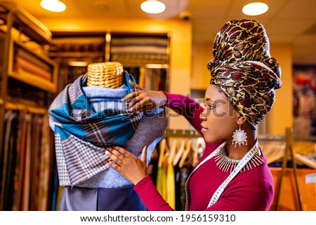 latino spain salewoman in storage update cotton and lace fabric showroom Royalty-Free Stock Photo #1956159310
