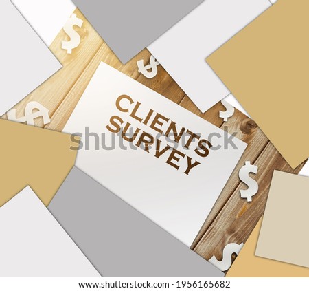 words Clients Survey on page, paper dollar signs on wooden table. business feedback concept.