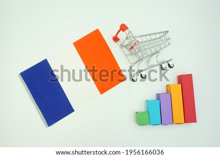 French national flag with miniature shopping trolley and colorful diagram isolated on white background