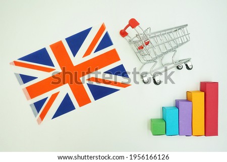 England national flag with miniature shopping trolley and colorful diagram isolated on white background