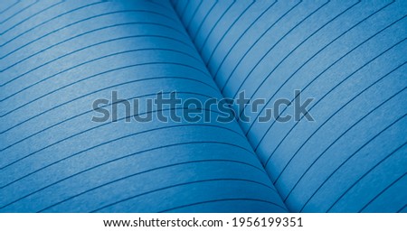blue pages from a lined notebook. background