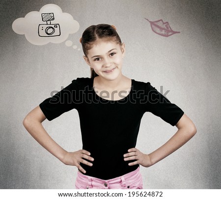 Closeup portrait happy confident successful little girl in black t-shirt ready for challenge asking ok whats next arms on waist gesture, isolated black background. Positive emotion expression attitude
