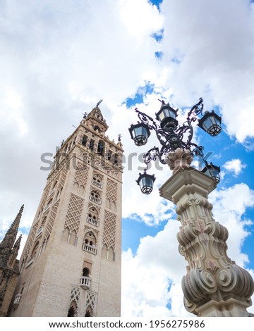 La Giralda, the bell tower of Seville Cathedral on a sunny spring day, in Spain.