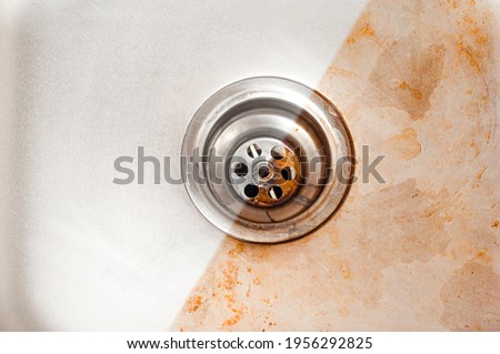 Kitchen sink before and after washing with a special detergent Royalty-Free Stock Photo #1956292825