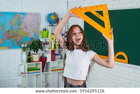 teen girl with triangle ruler. back to school. concept of education. measuring angle degree.