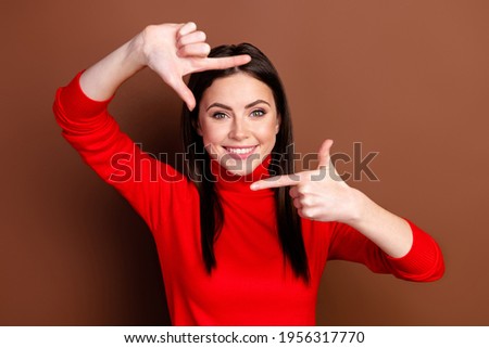 Photo of nice optimistic brunette hairdo lady do snap wear red sweater isolated on brown color background