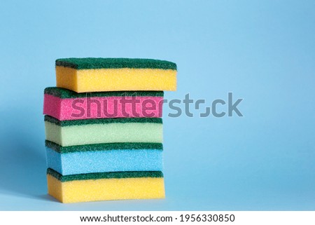 Cleaning supplies collection on blue background. Housework concept. Cleaning tools. 