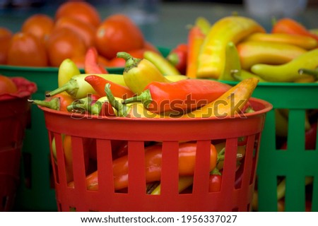 Fresh vegetables in baskets at a farmers market.  Royalty-Free Stock Photo #1956337027