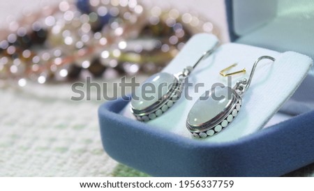 
Moonstone Earrings , 925 Sterling Silver Pendant is made with Natural Rainbow Moonstone Gemstone. Royalty-Free Stock Photo #1956337759