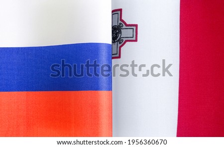 fragments of the national flags of Russia and Malta close-up