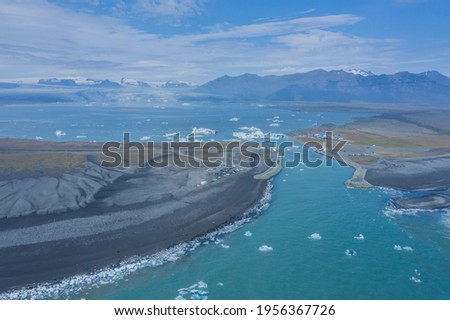 Aerial view of Diamond Beach, the Jökulsárlón glacier bridge and lagoon in Iceland in the morning
