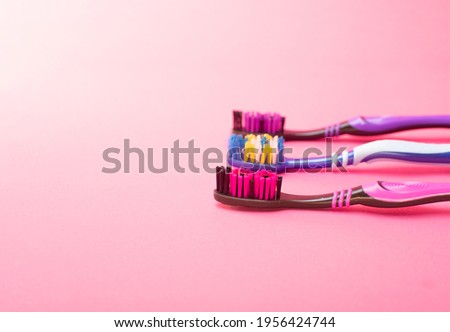 toothbrushes on a yellow background. 