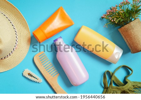 Summer travel cosmetic products for hair care. Shampoo, balm, conditioner. Flat lay composition object photography