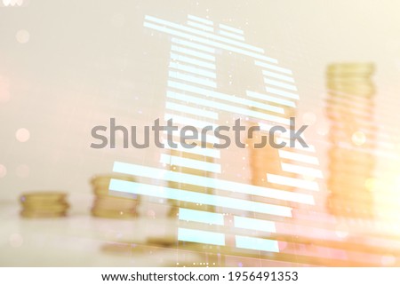 Double exposure of creative Bitcoin symbol hologram on growing stacks of coins background. Cryptocurrency concept