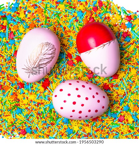 Pink easter eggs on bright candies