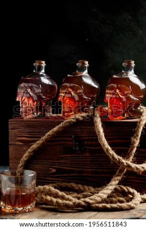 Bottles in the form of a skull with strong alcohol, rum, pirate mood.